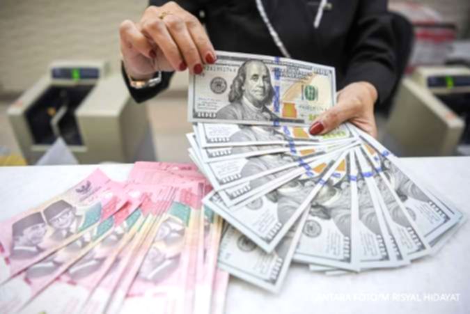 Tampilan grafis pergerakan nilai tukar mata uang Rupiah terhadap Dolar AS di layar monitor.