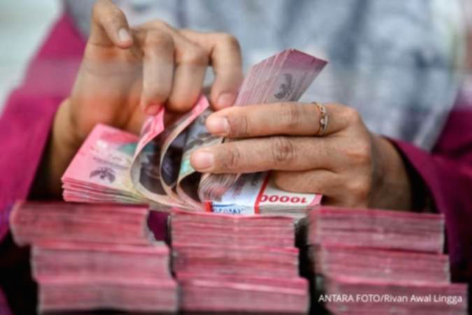 Grafik pergerakan nilai tukar Rupiah terhadap Dolar AS yang melemah di pasar spot