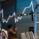 Grafik pergerakan Indeks Harga Saham Gabungan di layar monitor bursa efek
