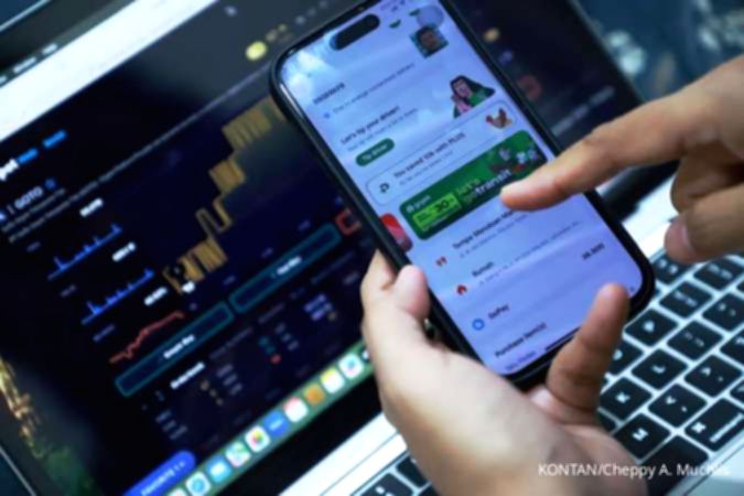 Grafik pergerakan harga saham di layar monitor bursa efek