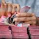 Grafik pergerakan nilai tukar mata uang Rupiah terhadap Dolar Amerika Serikat di layar monitor perdagangan.
