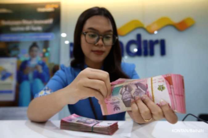 Papan layar digital menampilkan grafik pergerakan nilai tukar mata uang rupiah terhadap dolar Amerika Serikat