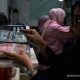 Grafik pergerakan nilai tukar mata uang Rupiah terhadap Dolar AS di layar monitor perdagangan