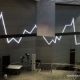 Grafik pergerakan Indeks Harga Saham Gabungan di layar monitor bursa efek