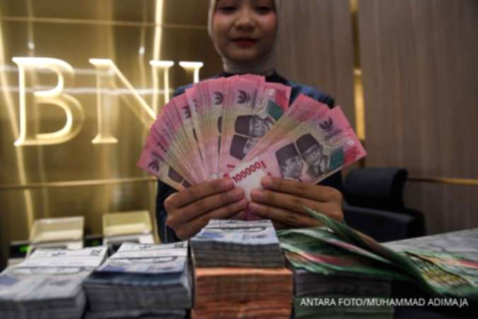Grafik pergerakan nilai tukar mata uang Rupiah terhadap Dolar Amerika Serikat di layar monitor