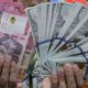 Tampilan layar grafik pergerakan nilai tukar rupiah terhadap dolar AS di pasar keuangan.
