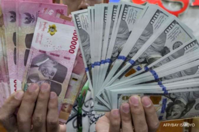 Tampilan layar grafik pergerakan nilai tukar rupiah terhadap dolar AS di pasar keuangan.