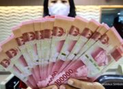 Grafik pergerakan nilai tukar mata uang Rupiah terhadap Dolar AS yang melemah di pasar spot
